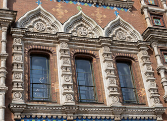 Fototapeta premium view of rustic style carved windows of Savior on the Spilled Blood Church in Saint Petersburg, Russia, 21th of July, 2025, historical architecture detail of cultural heritage, famous landmark