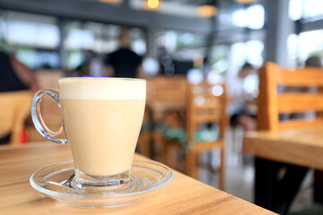 cappuccino, coffee in a clear glass cup in a cafe, soft color background food and drink, hot drink