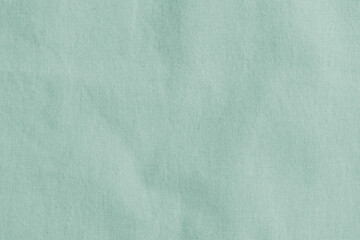 Green cotton canvas background of burlap natural fabric linen cloth texture  in lime teal cyan green for wallpaper and design backdrop