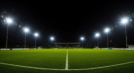 Fototapeta premium Empty Football Field Under Bright Night Lights in Stadium
