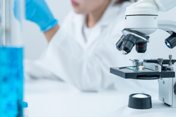 Scientist analyze biochemical samples in advanced scientific laboratory. Medical professional use...