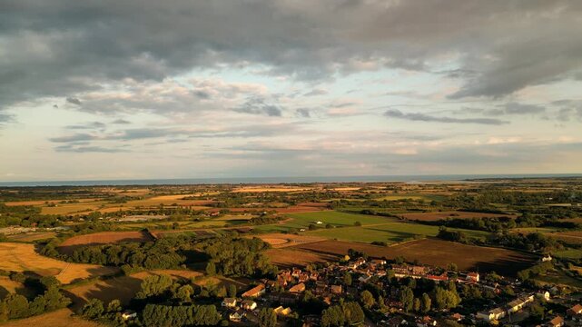 Drone aerial view over the West Sussex countryside in England at sunset
