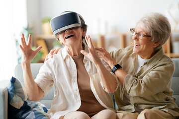 women playing console games wearing vr goggles