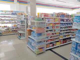 Blurred Bright Clean Convenience Store Interior. 
Blurred a well-organized convenience store...