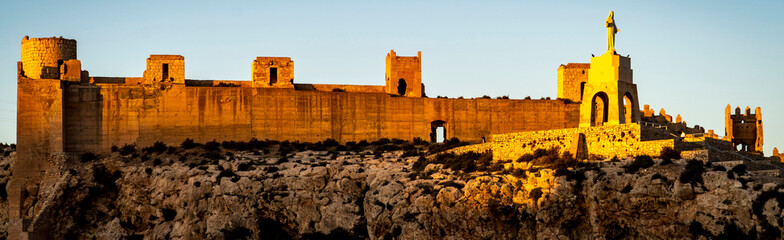 Golden Sunset Over Ancient Fortress in Almeria