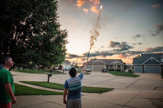 Firework sparks fly as father and son share summer joy