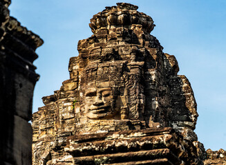 Intricate Stone Carving of a Face at Bayon Temple, in Angkor Wat, Cambodia