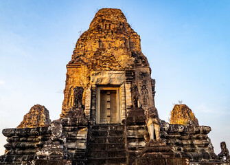 Ancient Temple Structure Against Blue Sky, in Angkor Wat, Cambodia