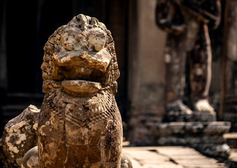 Weathered Stone Lion Statue at Ancient Temple, in Angkor Wat, Cambodia