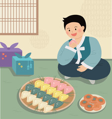 Korean boy in hanbok eating songpyeon rice cakes during Chuseok