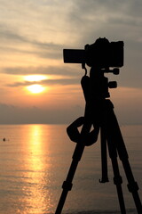 Sunrise with DLSR camera and tripod