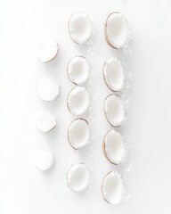 Coconut Shells Arranged in Rows with Water Droplets on White Surface