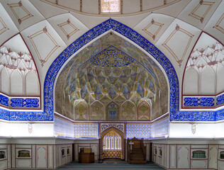 Ornate Mosque Interior with Intricate Tile Work and Calligraphy