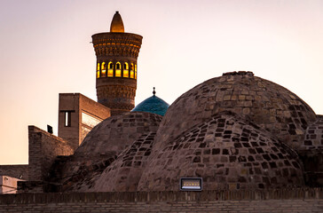 Traditional Domed Architecture with Minaret at Dusk