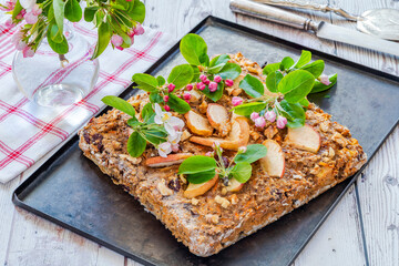 Home baked rolled oats, carrots, apples and walnuts flapjack for healthy breakfast