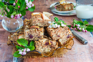 Home baked rolled oats, carrots, apples and walnuts flapjack for healthy breakfast