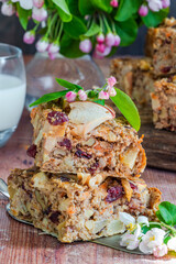 Home baked rolled oats, carrots, apples and walnuts flapjack for healthy breakfast