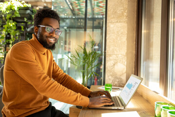 Entrepreneur man working from workspace concentrating on virtual presentation