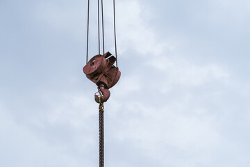 Moscow, Russia, 18.06.2025 Heavy duty metal block and tackle with chains and cables suspending for...