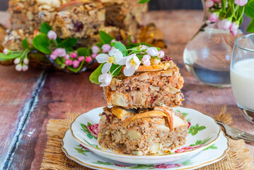 Home baked rolled oats, carrots, apples and walnuts flapjack for healthy breakfast