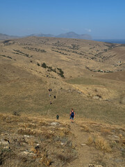 group of travelers hiking down the mountain