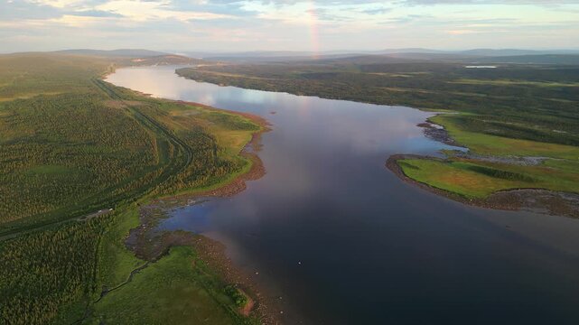 Aerial view of Stora Lulevatten river flowing through a green landscape in Norrbotten County, Sweden