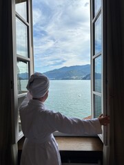 woman looking out window
