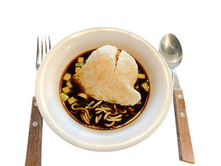 Pempek is a traditional Indonesian dish made from fish and tapioca from Palembang. It is served with a sweet and sour sauce on a white background