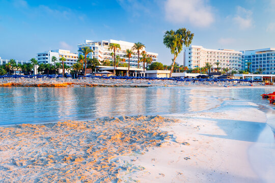 Morning at the famous Nissi Beach in Ayia Napa, Cyprus. Tropical beach with white sand and crystal clear waters, seaside resort in Cyprus.
