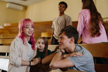 Obraz premium Group of Young Students Socializing in a Classroom Setting