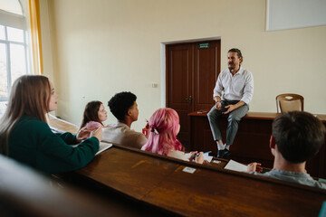 University Professor Engages with Students During Interactive Classroom Lecture