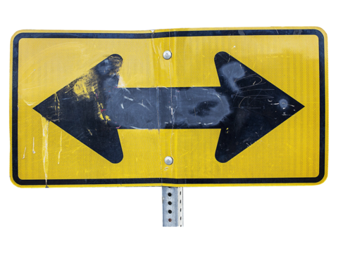Sign of Direction: A weathered road sign displays two opposing arrows, suggesting a crossroads and a pivotal decision, embodying choices, decisions, and guidance