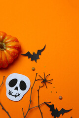 Black bats, skull, spider and decorative branches. Happy Halloween. Top view, space for text