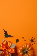 Vertical view of gift box and Halloween decorations