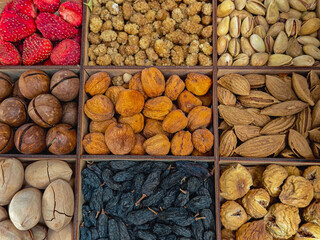 Assorted Dried Fruits and Nuts in Wooden Box — Top View