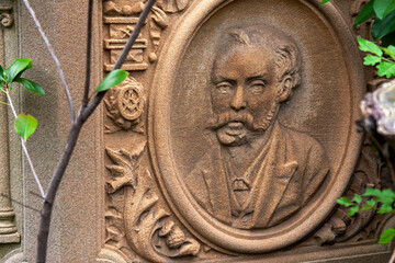 A carved stone relief  of a man - Rookwood Necropolis, Sydney, NSW, Australia