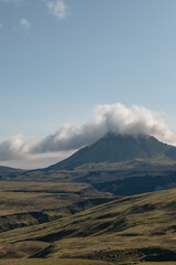 Mountain with Cloud Covered Peak and Rugged Icelandic Terrain