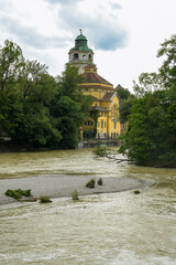 Isar with high water at the Müllersches Volksbad, a historic indoor swimming pool in Art Nouveau...