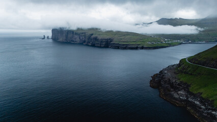 Cliffs and coastline of the Faroe Islands under moody skies showcasing dramatic natural beauty