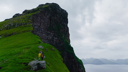 Stunning cliffs of Faroe Islands inviting hikers for an adventurous exploration