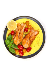 Cooked Salmon Fillet in sauce, isolated on white background