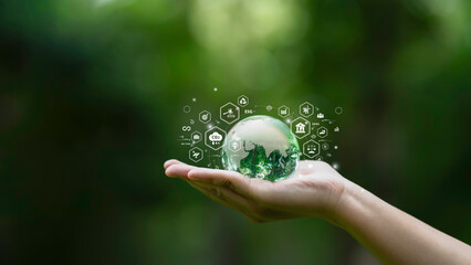 Hand holding a glass globe ESG icons of Sustainable Development, green business, circular economy,...