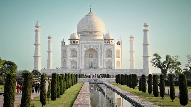 Iconic Taj Mahal Mausoleum with Symmetrical Reflecting Pool and Lush Garden, a UNESCO World Heritage Site in Agra, India