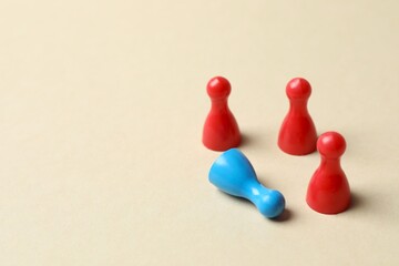 Closeup of pawns on beige background. Diversity, inclusion and equality concept
