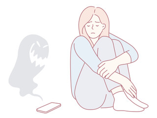 A young woman sits in distress, deeply reflecting the anxiety that is often linked to technology and social media usage