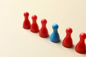 Colorful pawns on light background. Diversity, inclusion and equality concept, space for text
