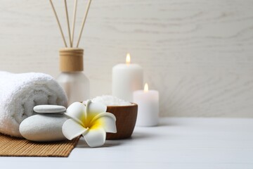 Spa and relax composition with flower, stones and aroma diffuser