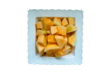 A plate of freshly chopped melon.