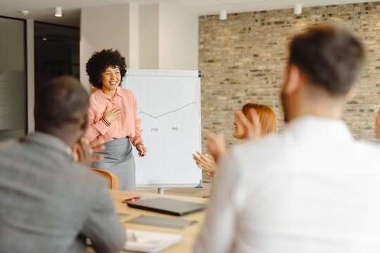 Business presentation with applause in office meeting