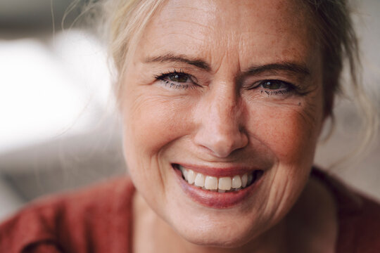 Smiling mature businesswoman in loft portrait